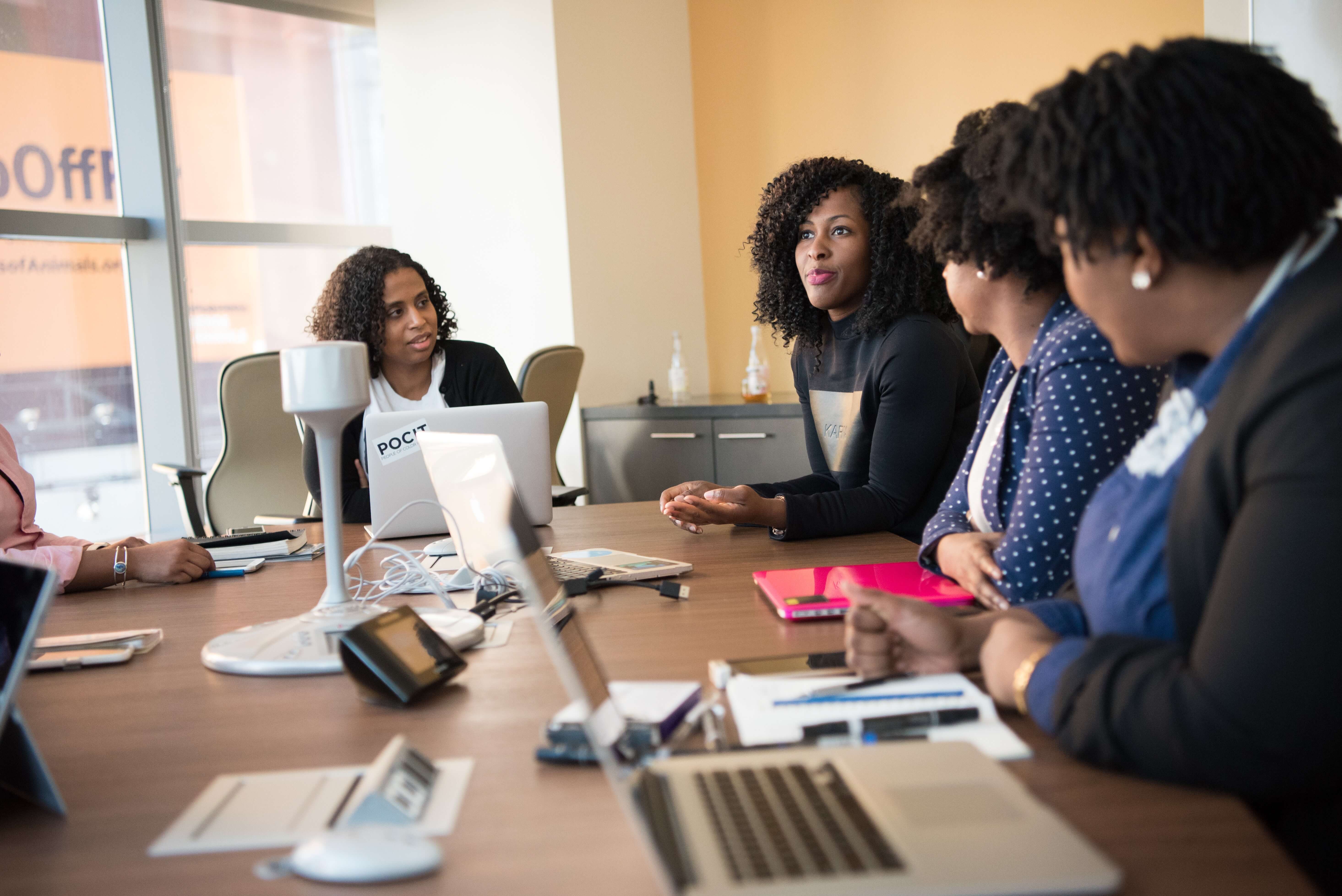 A marketing staff brain storming on strategies for a period